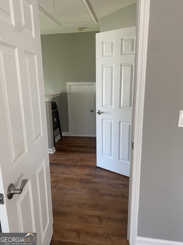 laundry room with dark hardwood / wood-style floors