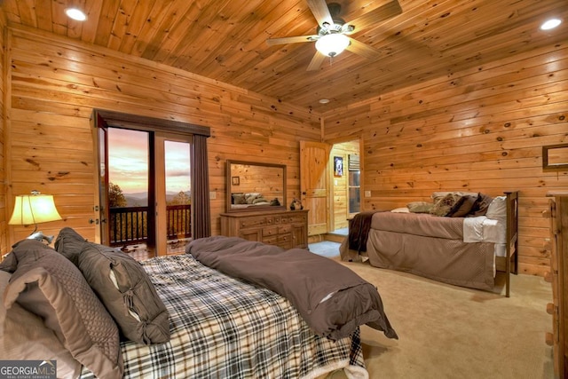 bedroom featuring ceiling fan, wood walls, and access to exterior