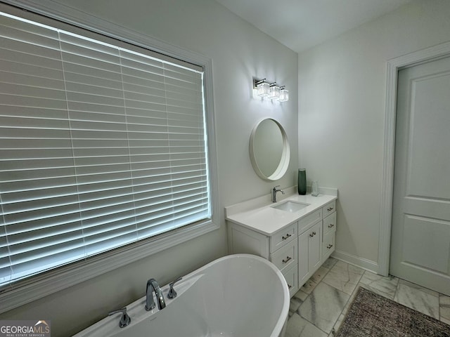 bathroom with a bath and vanity