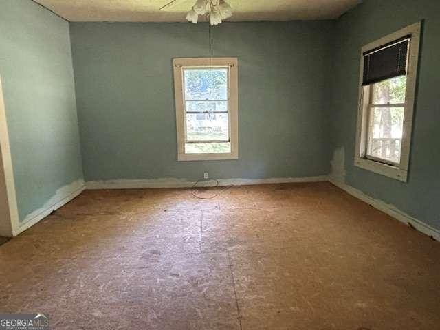 unfurnished room with ceiling fan