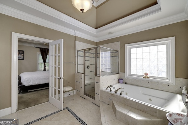 bathroom with plus walk in shower, tile patterned flooring, and ornamental molding