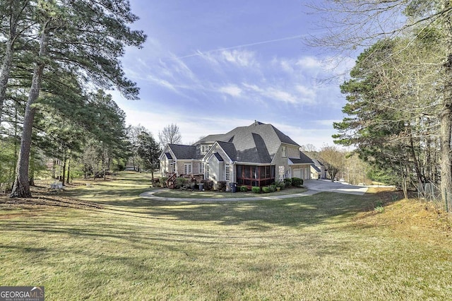 exterior space with a front yard and a garage