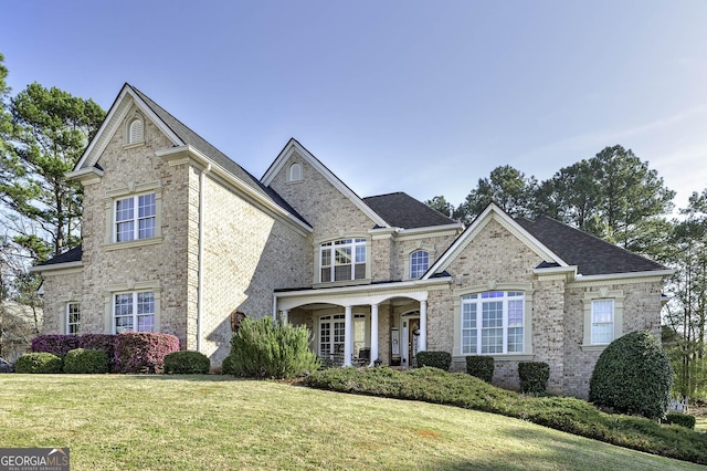 view of front of house featuring a front yard and a porch