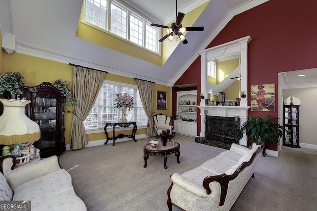 living room with carpet flooring, ceiling fan, and crown molding