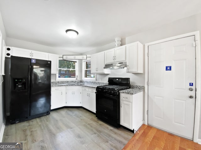 kitchen featuring sink, white cabinets, and black appliances