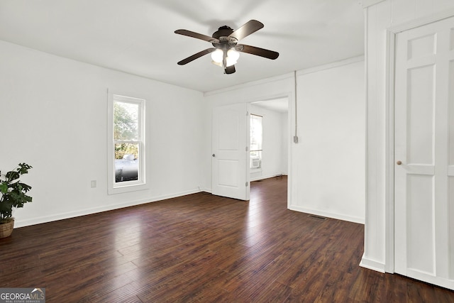 spare room featuring dark hardwood / wood-style floors and ceiling fan