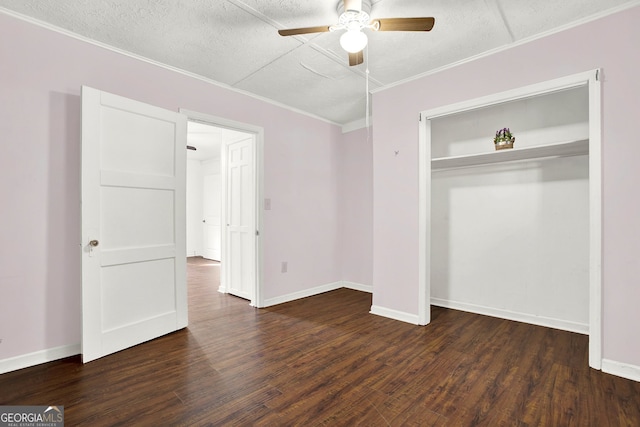 unfurnished bedroom with a textured ceiling, ceiling fan, a closet, and dark hardwood / wood-style floors