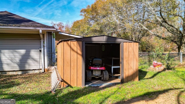 view of outbuilding featuring a yard