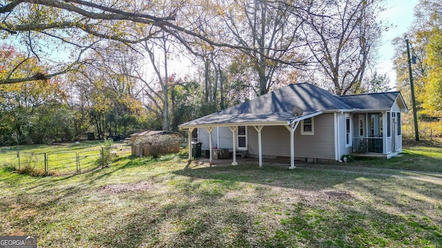 view of side of home featuring a lawn