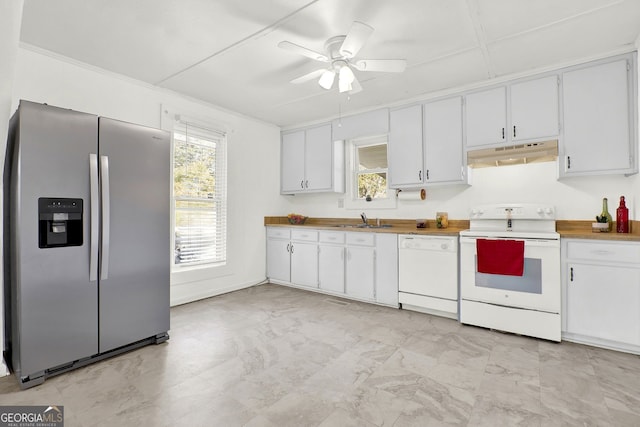 kitchen with ceiling fan, sink, white cabinets, and white appliances