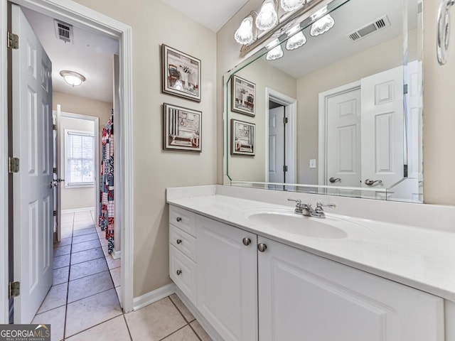 bathroom with vanity and tile patterned flooring