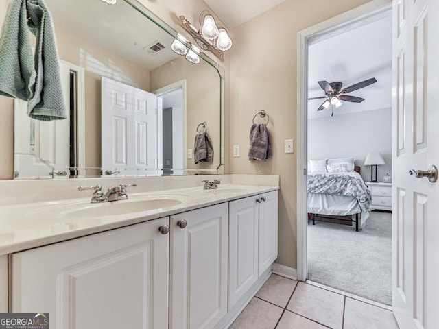 bathroom featuring tile patterned flooring, vanity, and ceiling fan