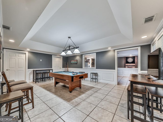 rec room with billiards, a raised ceiling, and light tile patterned floors