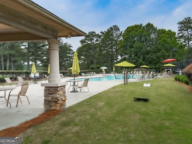 exterior space featuring a patio and a lawn