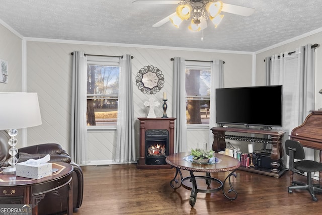 living room featuring a textured ceiling, wood walls, dark hardwood / wood-style flooring, and crown molding