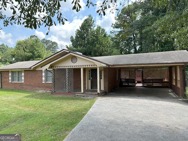 ranch-style home featuring a front yard and a carport