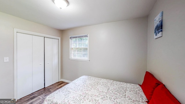 bedroom featuring wood-type flooring and a closet