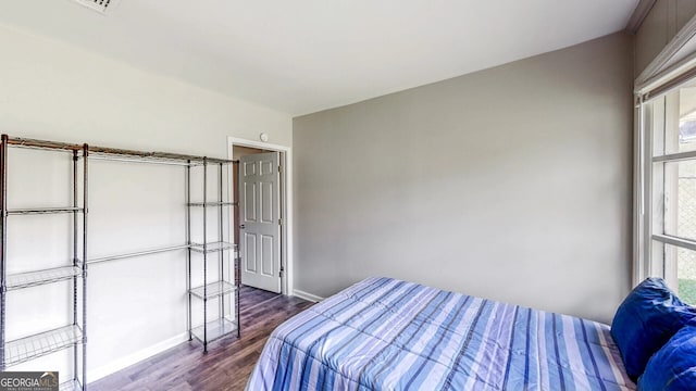 bedroom featuring dark wood-type flooring