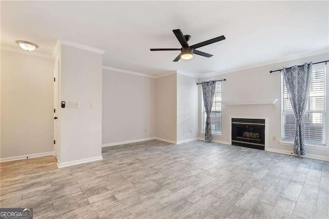 unfurnished living room with light wood-type flooring, a wealth of natural light, and a fireplace