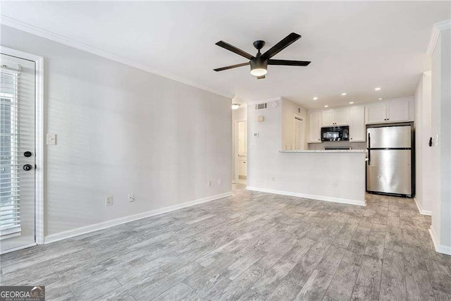 unfurnished living room featuring recessed lighting, light wood-style flooring, a ceiling fan, ornamental molding, and baseboards