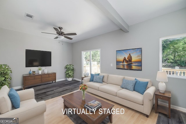 living room featuring ceiling fan, beam ceiling, and wood-type flooring