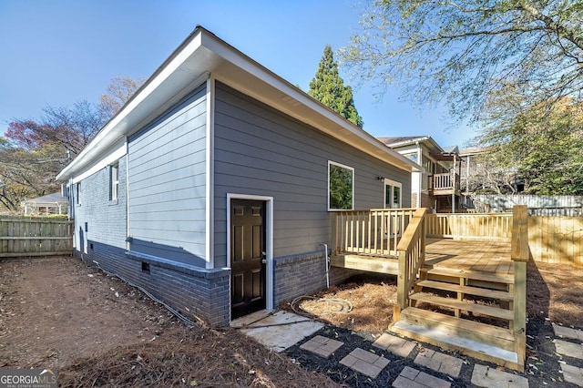 view of home's exterior with a deck