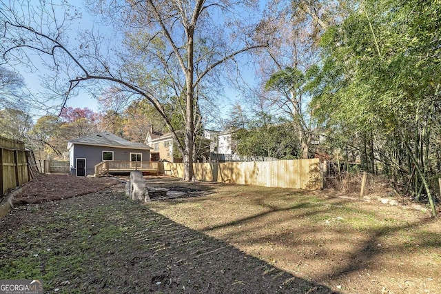 view of yard with a wooden deck