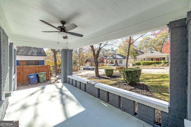 view of patio with ceiling fan and a porch