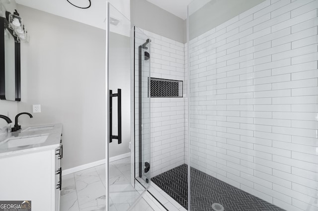 bathroom with vanity and a shower with shower door