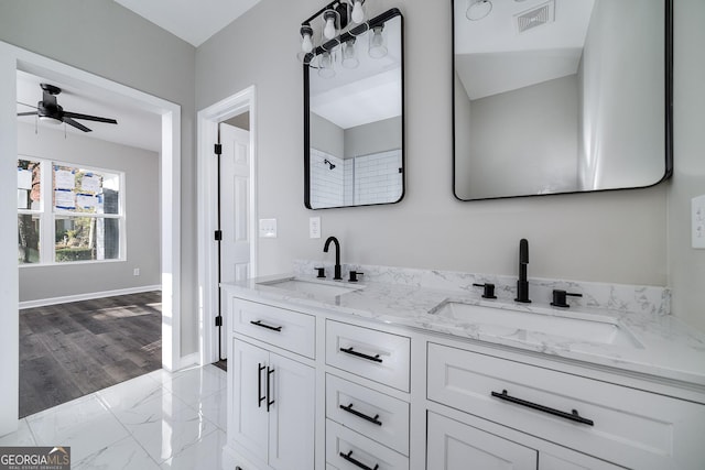 bathroom with ceiling fan, hardwood / wood-style floors, and vanity