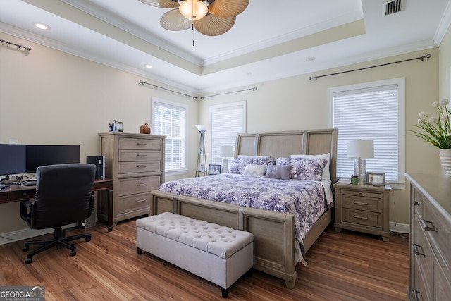 3798 Bermuda Run Dr, Valdosta, GA 31605 - bedroom featuring a raised ceiling, dark wood finished floors, ornamental molding, recessed lighting, and an office area