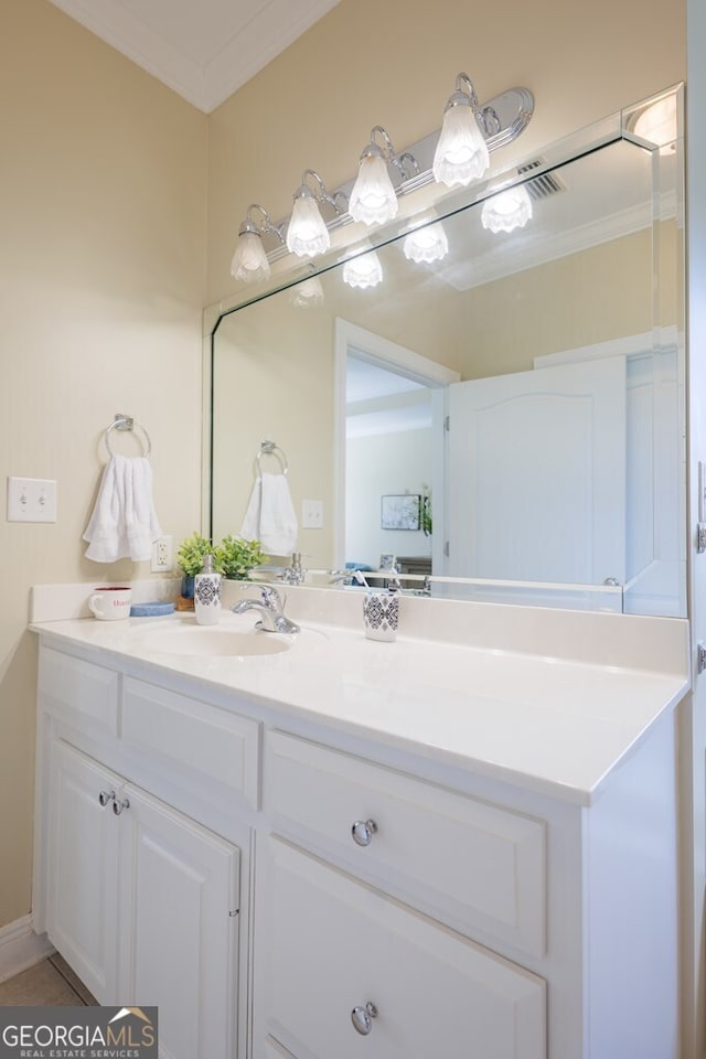 bathroom featuring vanity and ornamental molding