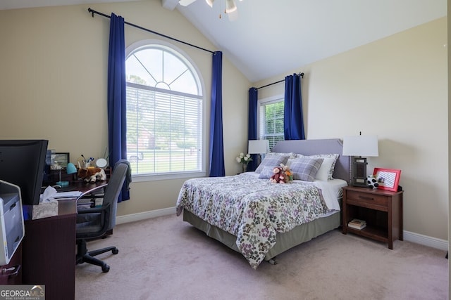 bedroom featuring ceiling fan, vaulted ceiling, light carpet, and multiple windows