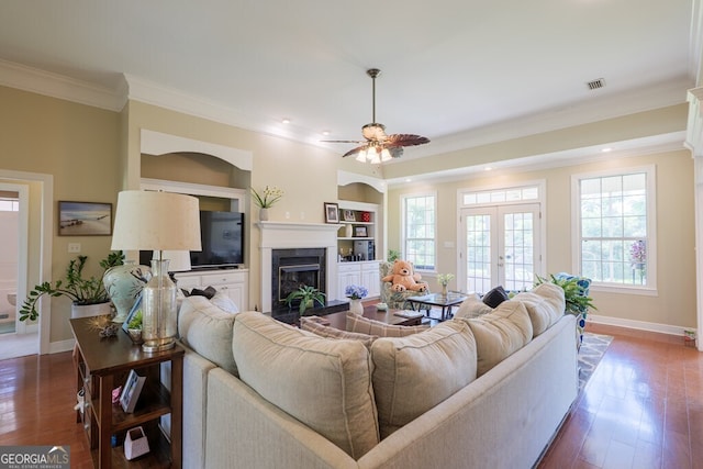 3798 Bermuda Run Dr, Valdosta, GA 31605 - living area with a ceiling fan, ornamental molding, a premium fireplace, dark wood-type flooring, and built in features
