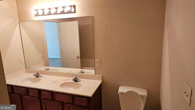 bathroom with vanity and toilet