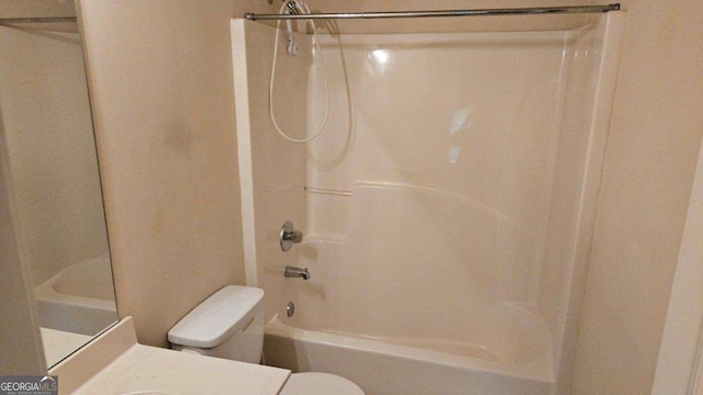 full bathroom with bathtub / shower combination, vanity, and toilet