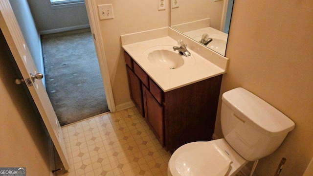 bathroom featuring vanity and toilet