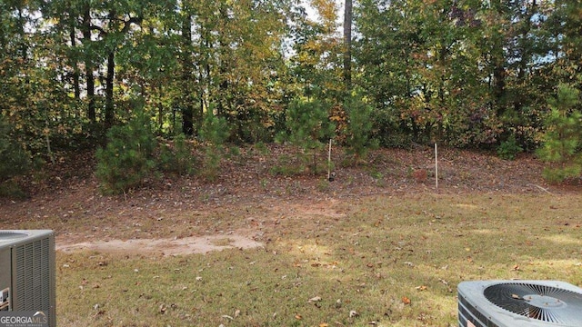 view of yard featuring central AC unit