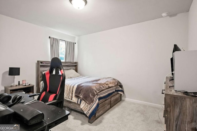 bedroom featuring baseboards and carpet floors