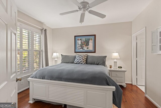 bedroom with ceiling fan and wood-type flooring