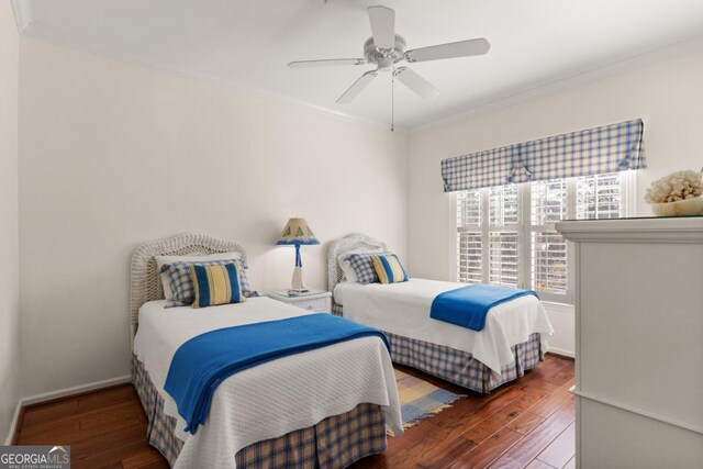 bedroom with ceiling fan, hardwood / wood-style floors, and crown molding