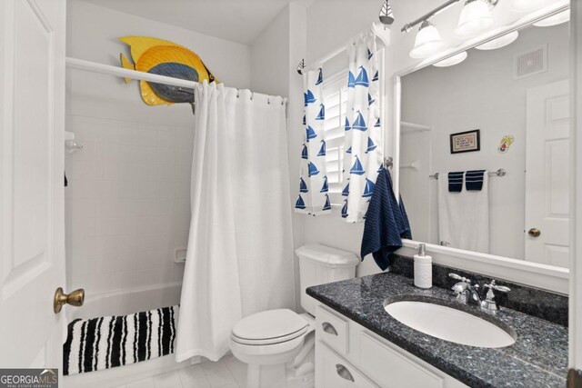 full bathroom featuring tile patterned floors, shower / bath combination with curtain, toilet, and vanity