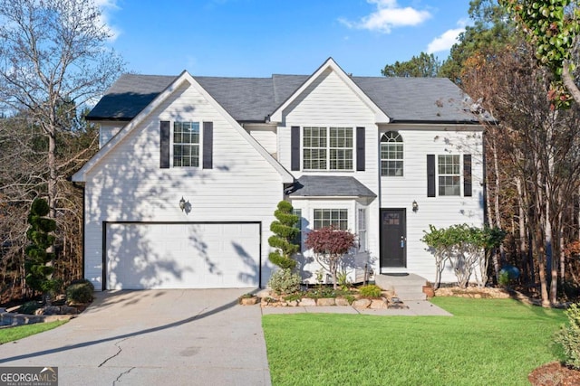 front facade with a front yard and a garage