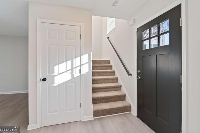 entrance foyer featuring a healthy amount of sunlight and light hardwood / wood-style floors