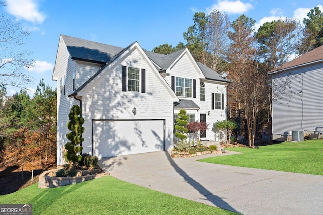 front facade featuring a front yard and a garage