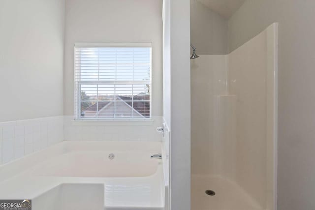 bathroom with separate shower and tub