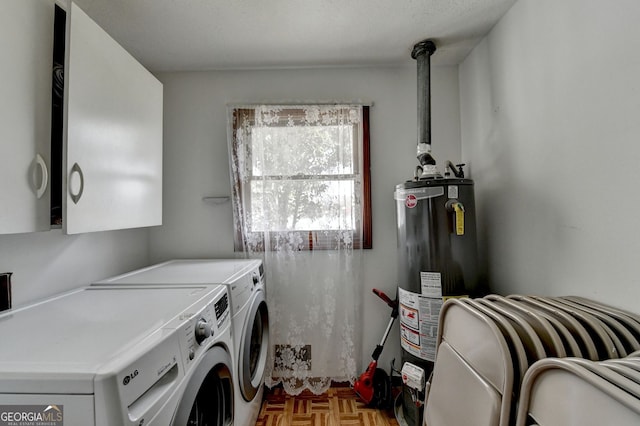 3615 Miller Bottom Rd, Loganville, GA 30052 - laundry area with washing machine and dryer, water heater, and light parquet flooring