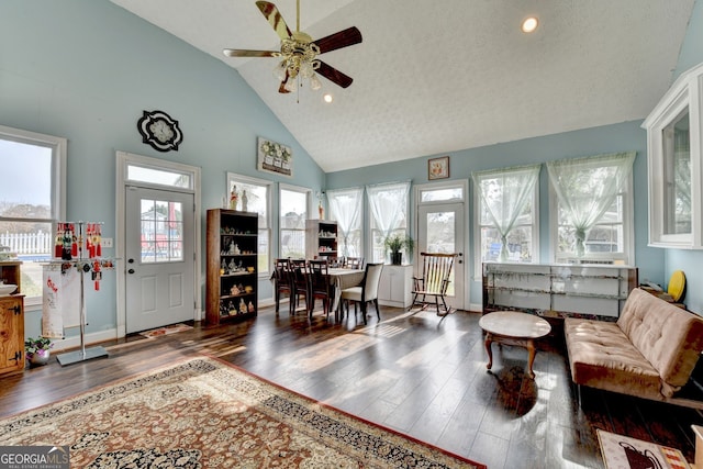3615 Miller Bottom Rd, Loganville, GA 30052 - living room with ceiling fan, dark hardwood / wood-style flooring, high vaulted ceiling, and a textured ceiling