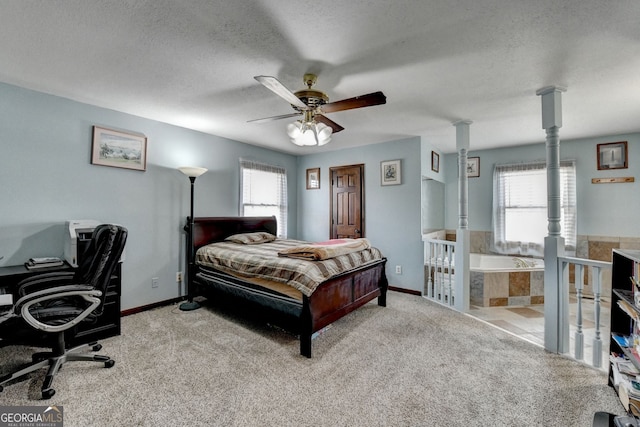 3615 Miller Bottom Rd, Loganville, GA 30052 - bedroom featuring light carpet, a textured ceiling, and ceiling fan