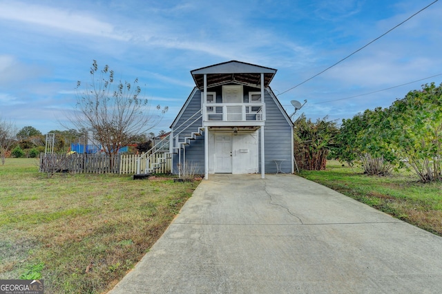 3615 Miller Bottom Rd, Loganville, GA 30052 - view of front of house with a balcony and a front lawn